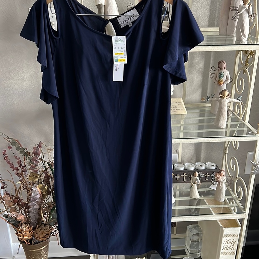 Dropped shoulders navy dress with rounded neck line.